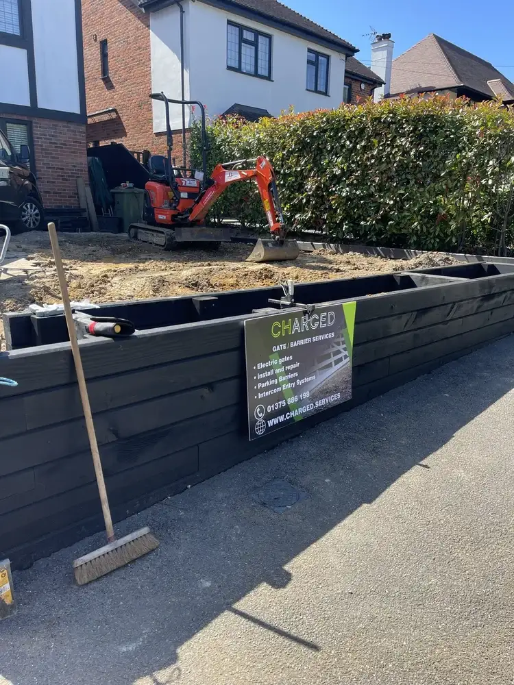 Excavated and landscaped driveway with level parking area