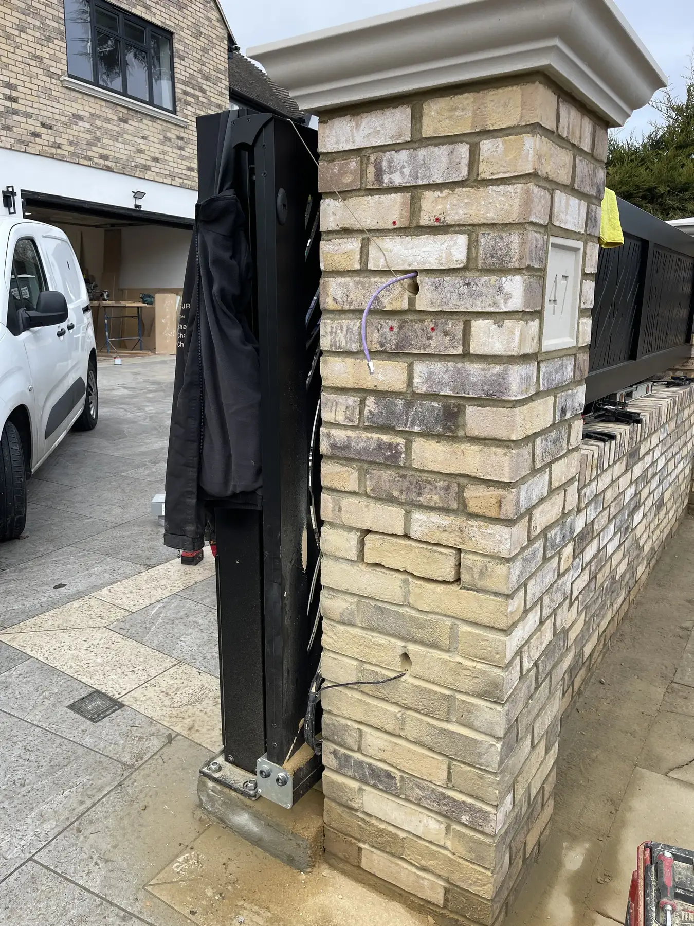 Brickwork with hidden cabling for intercom and lighting